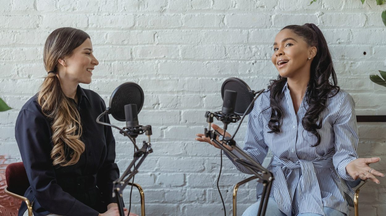 Two women interviewing with microphones