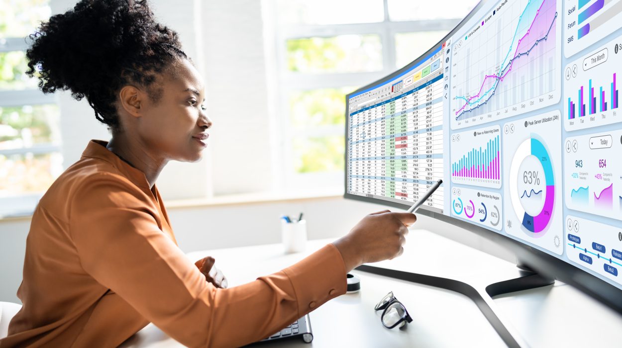 Analyst Woman Looking at large computer screen